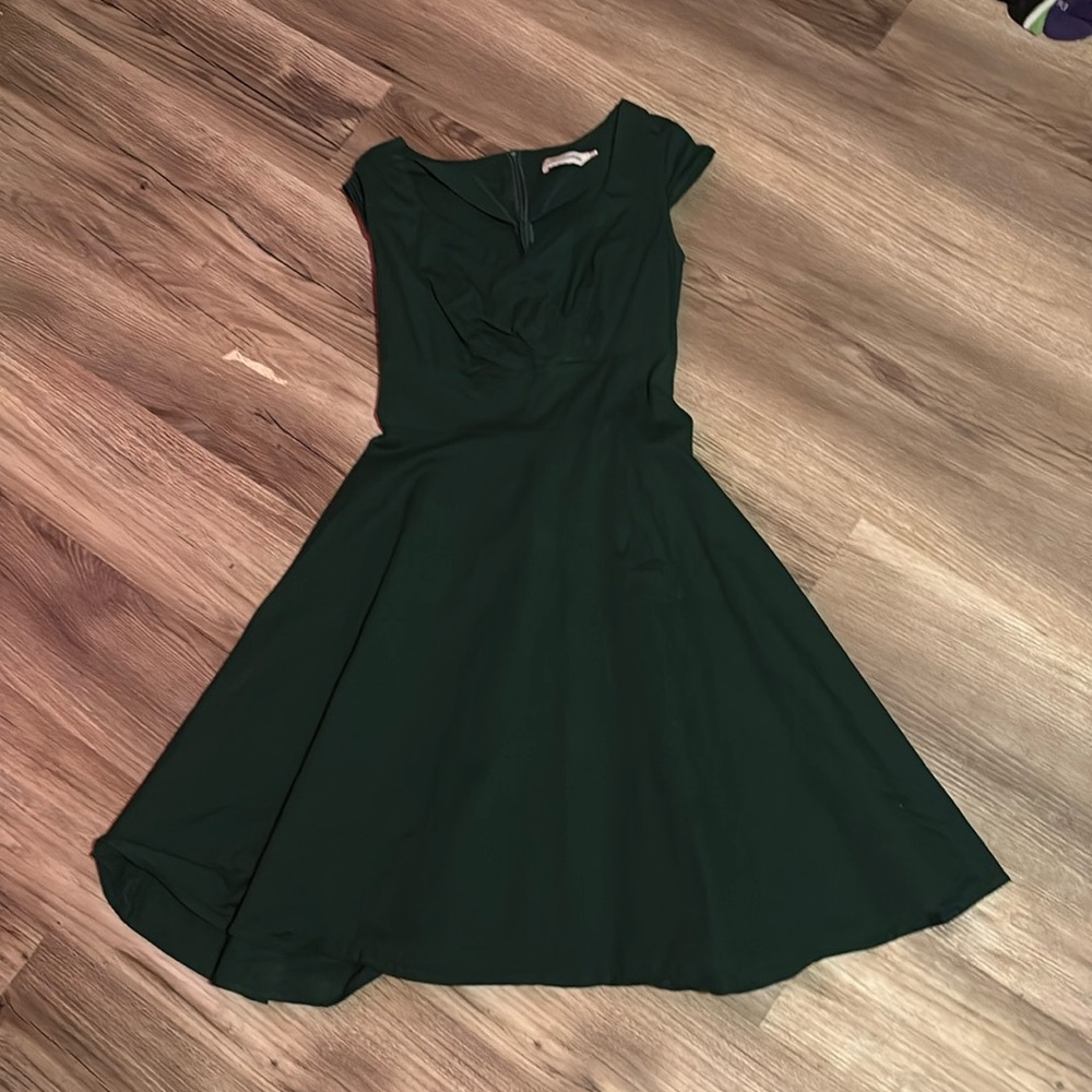 It’s a mid length green dress